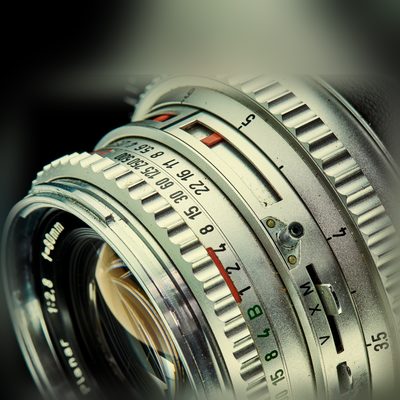 Original photo of a vintage camera lens before conversion